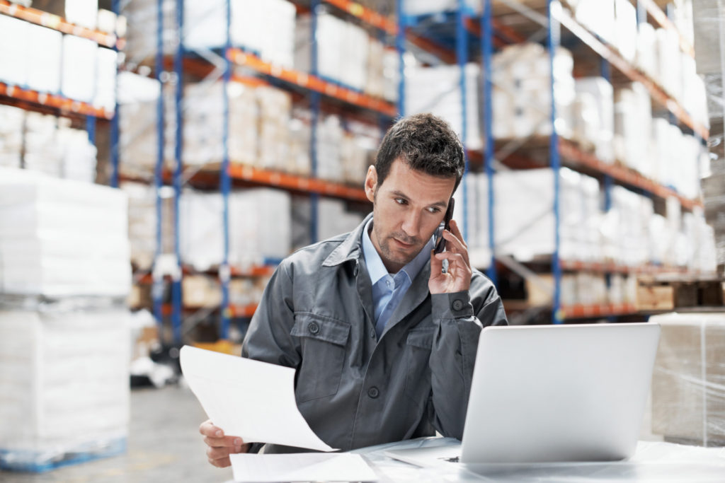 A young man in a warehouse